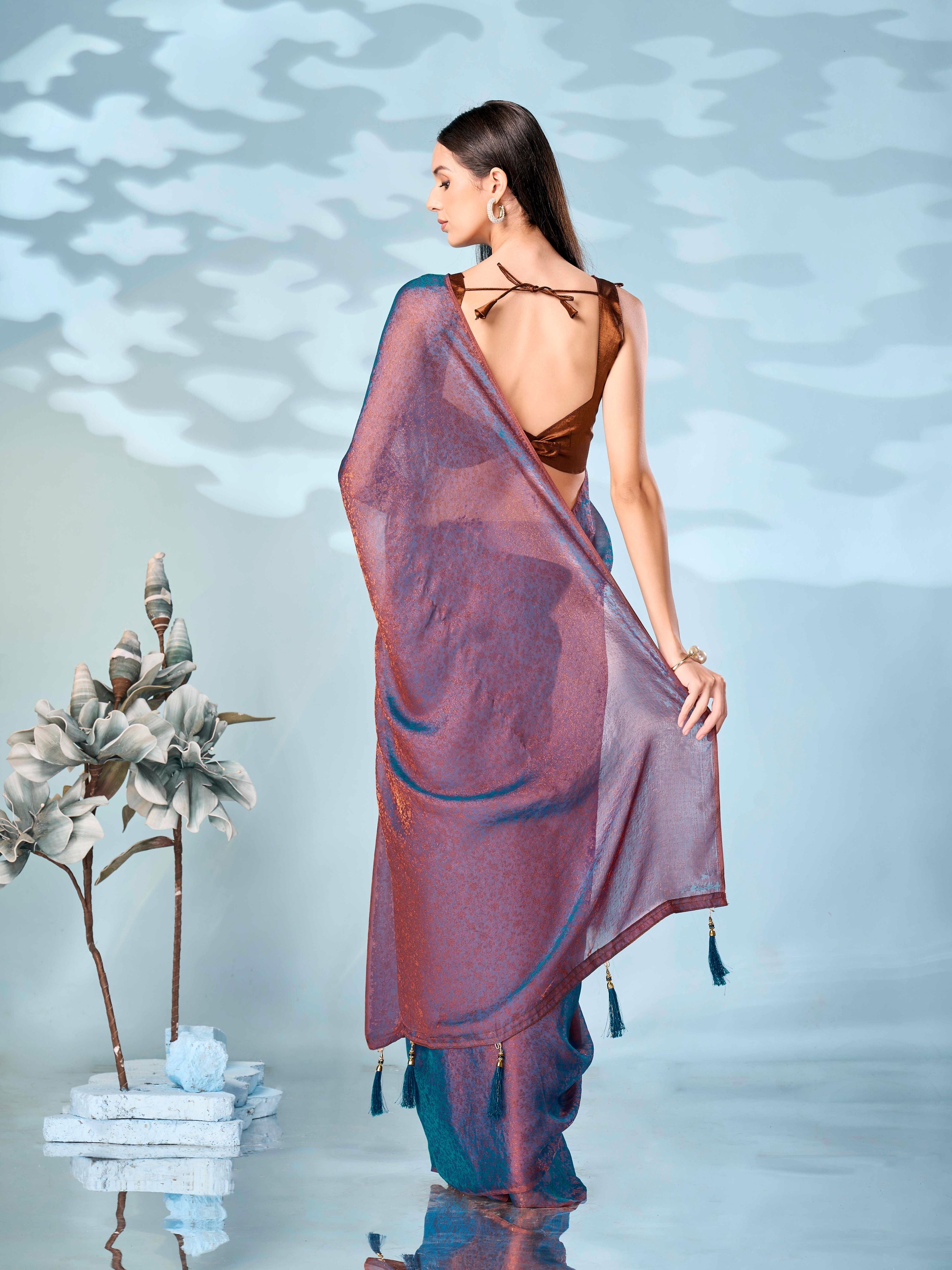 Two tone blue and bronze colored woven saree with tassles on pallu